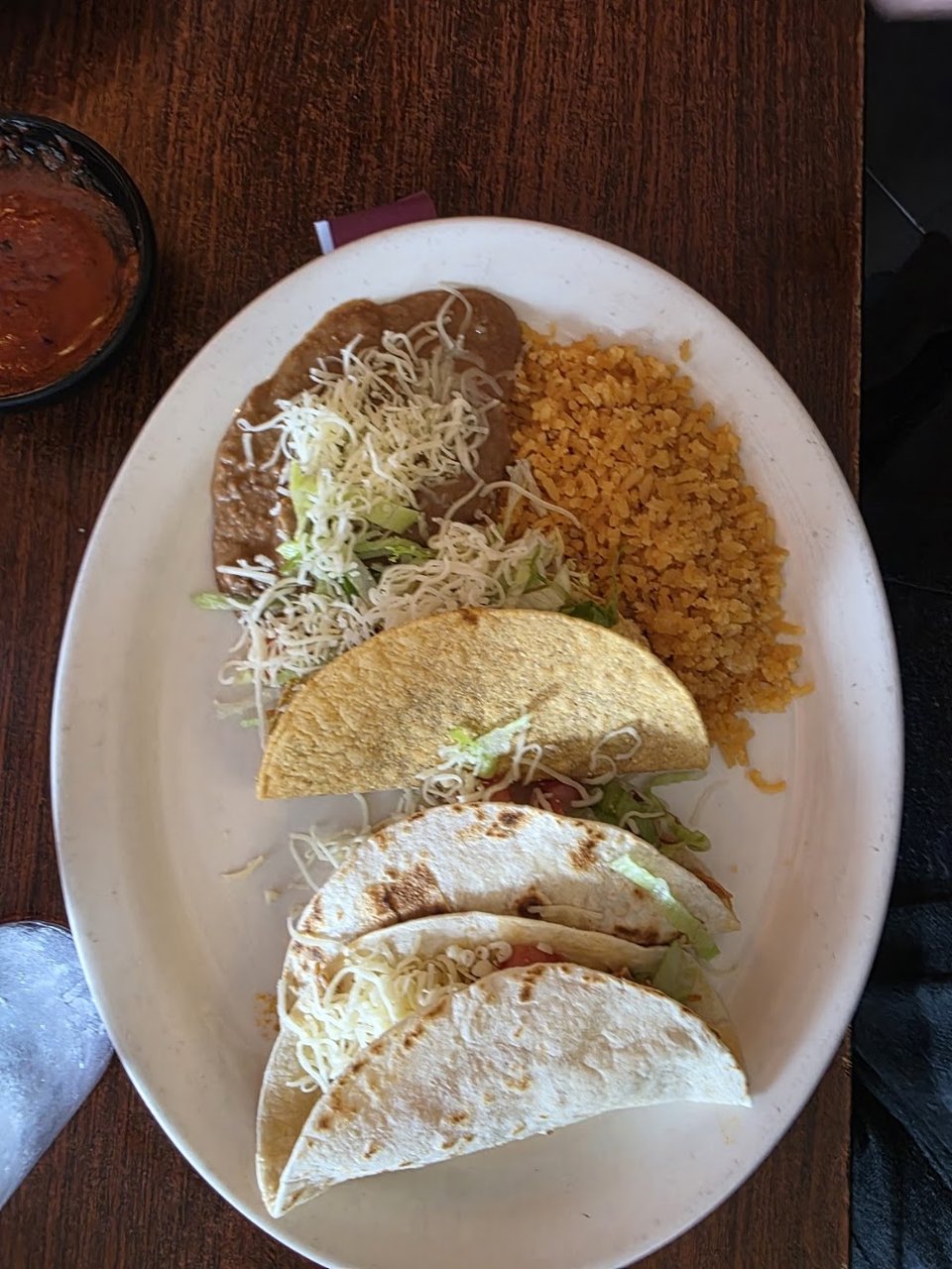Menu-style spread of tacos and enchiladas.